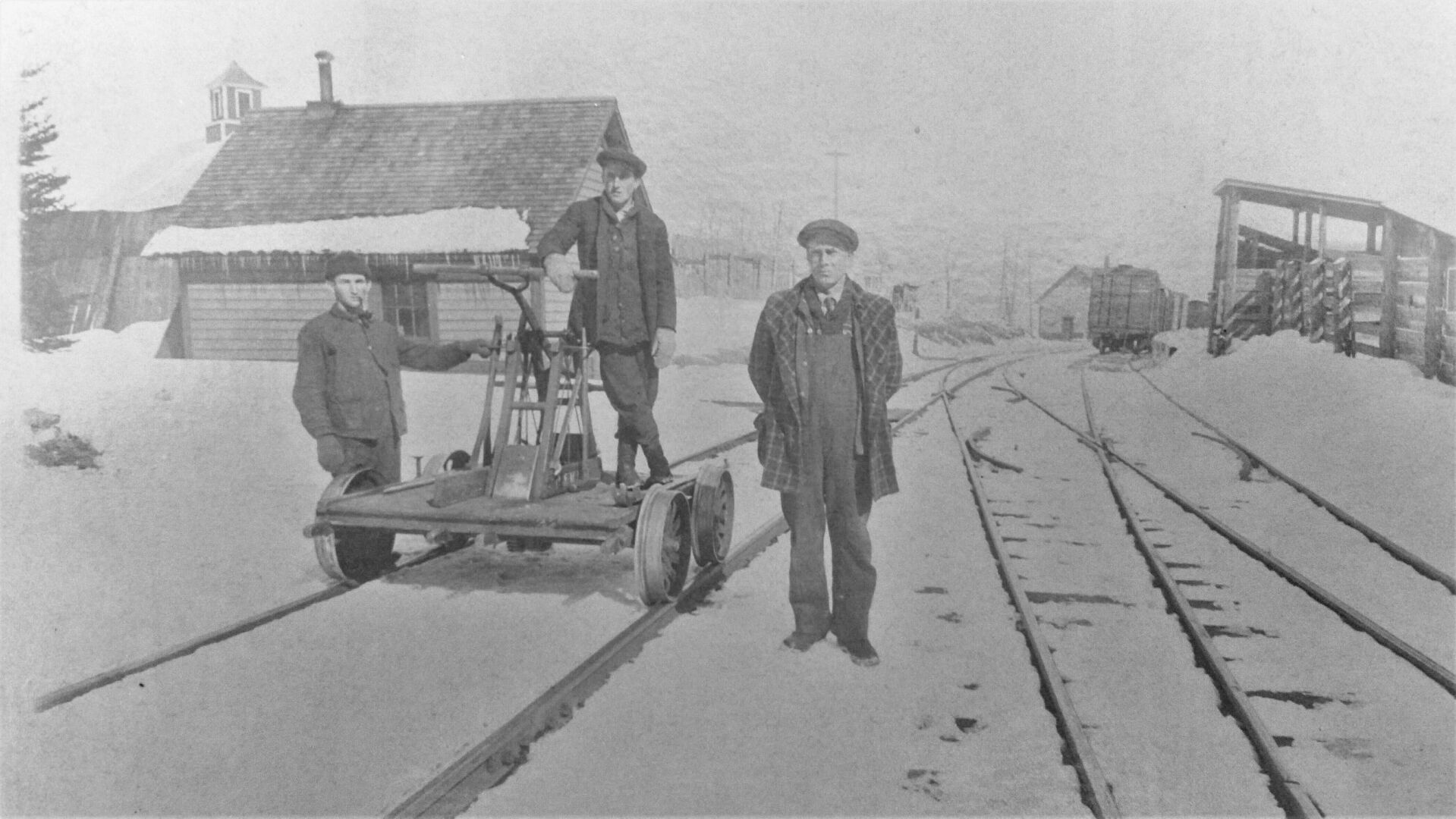 Railroad workers Lizime Plant, Harvey Peck, Fred Toussaint on a hand car near the Danville depot cattle pens.jpg